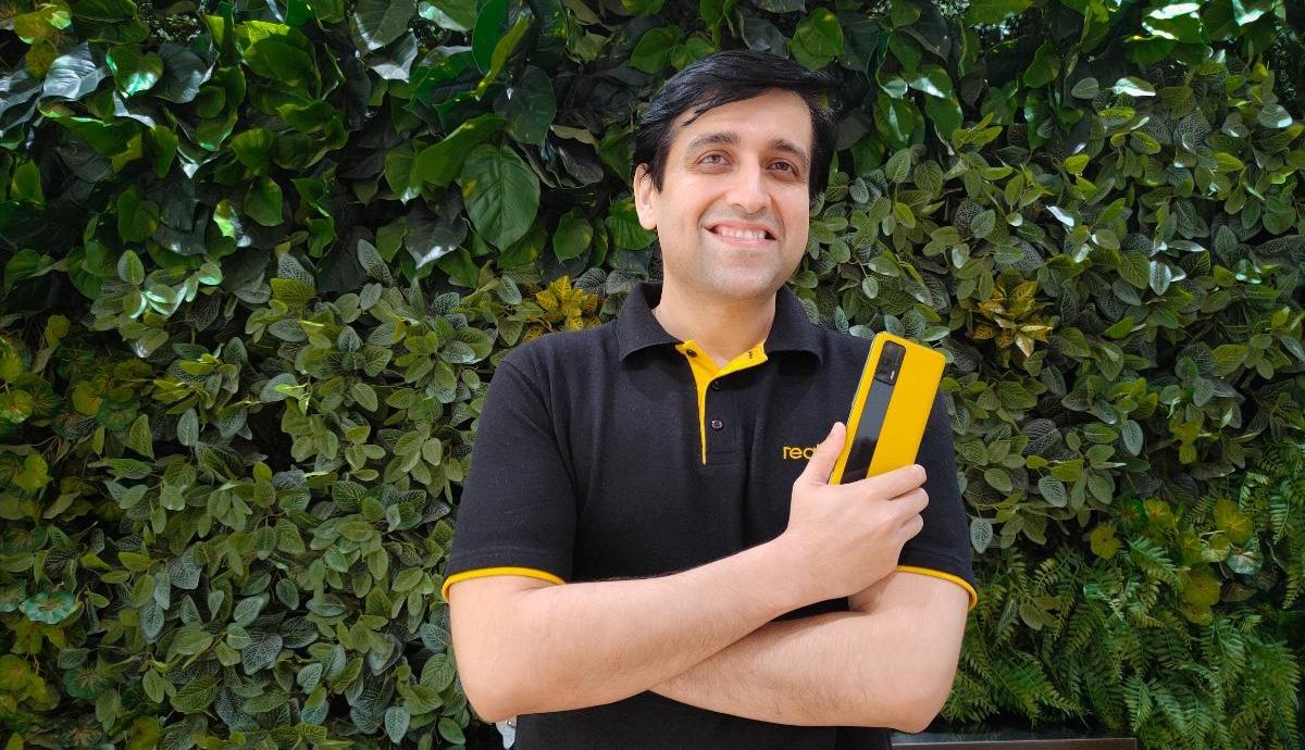 Madhav Seth with realme GT in hand